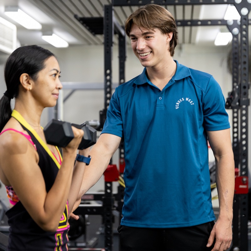 Personal trainer with client